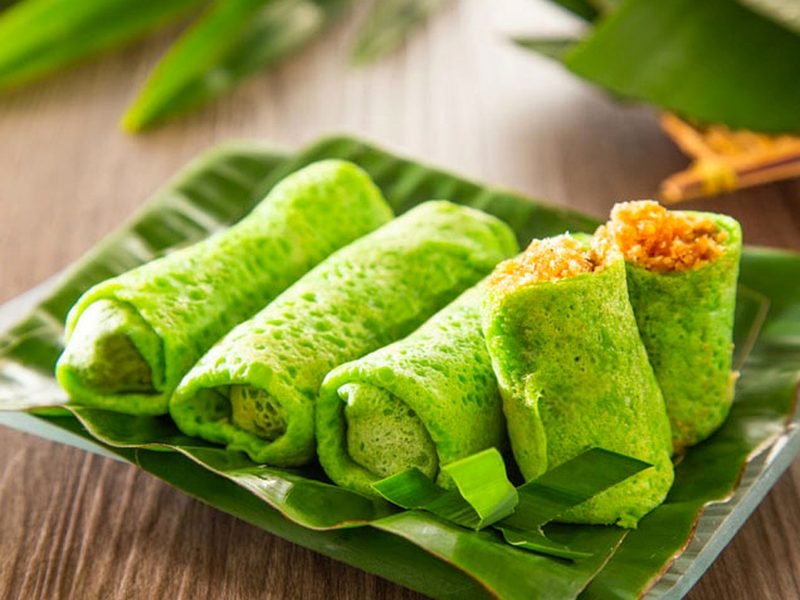 Kuih Ketayap — pandan crêpe rolls with gula Melaka coconut